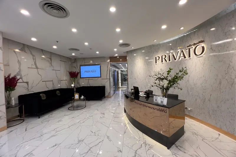 Reception desk with the Privato sign at Privato Clinic Asoke, a Sofwave clinic in Bangkok